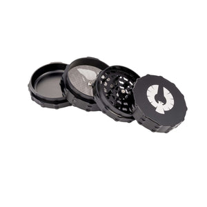 4 Piece large flat top herb grinder showcasing its open compartments and sleek design, perfect for cannabis enthusiasts.