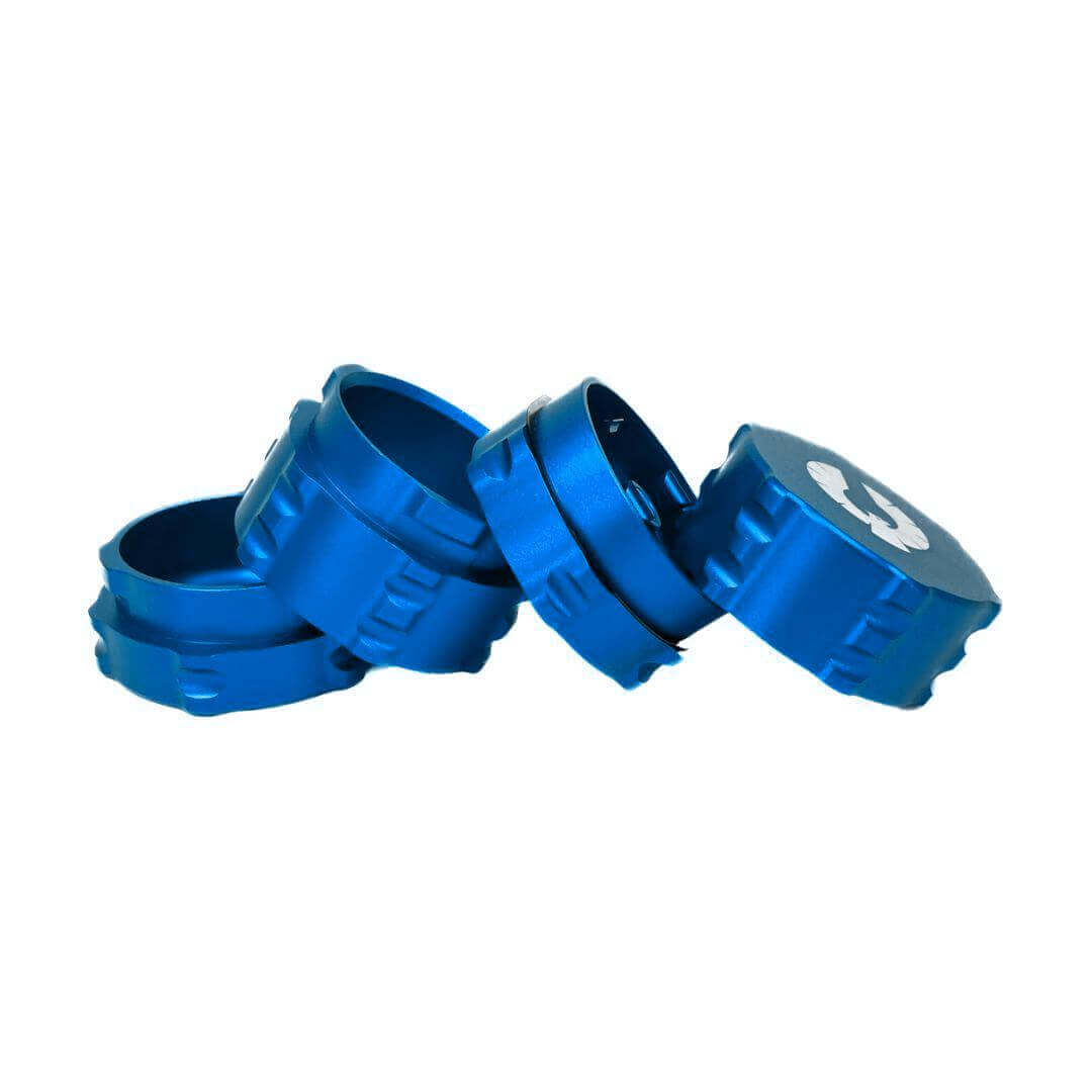 Blue 4 piece herb grinder with unique design, perfect for cannabis enthusiasts, showcasing sleek aluminum construction.