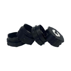 4 Piece small black herb grinder set from Phoenician, designed for cannabis enthusiasts, showcasing innovative features.