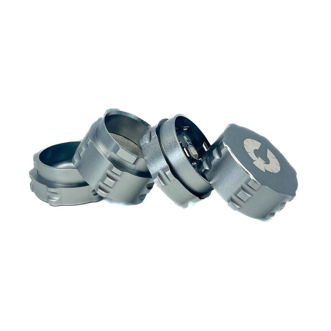 4 Piece small herb grinder from Phoenician, showcasing its sleek design and innovative features for cannabis enthusiasts.