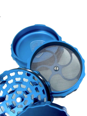 close-up of a Phoenician 4 piece large weed grinder in blue, showcasing the intricate design and mesh screen for optimal grinding