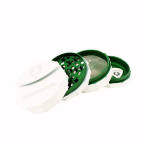 Limited Edition Harvest Moon herb grinder in white and green, featuring precision-engineered design for smooth grinding.
