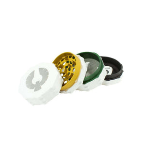 Limited Edition Super Moon Grinder in white, rasta interior colors of red, yellow, green, and black for herb enthusiasts.