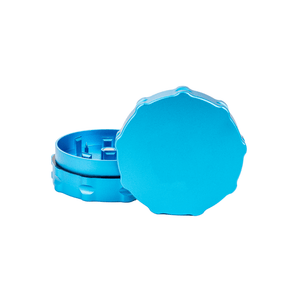 Custom two-piece medium weed grinder in blue, precision-engineered with aerospace-grade aluminum for dispensary use.