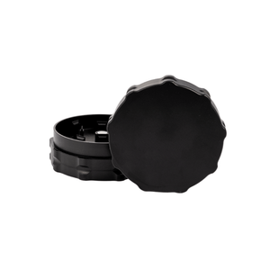 Custom two-piece black weed grinder designed for dispensary use, showcasing precision-engineered craftsmanship.