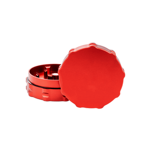 Custom two-piece red weed grinder made of aerospace-grade aluminum for dispensary use.