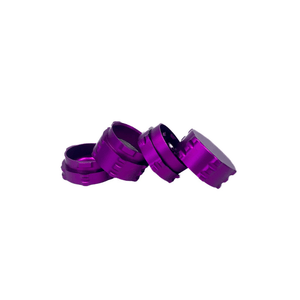 Custom purple aluminum weed grinder pieces stacked together for a sleek grinding experience.