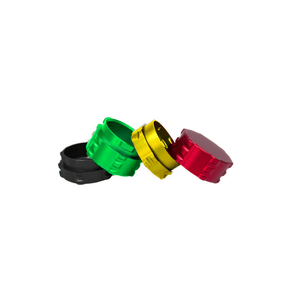 Colorful custom weed grinder caps in red, green, black, and gold for enhanced grinding experience.