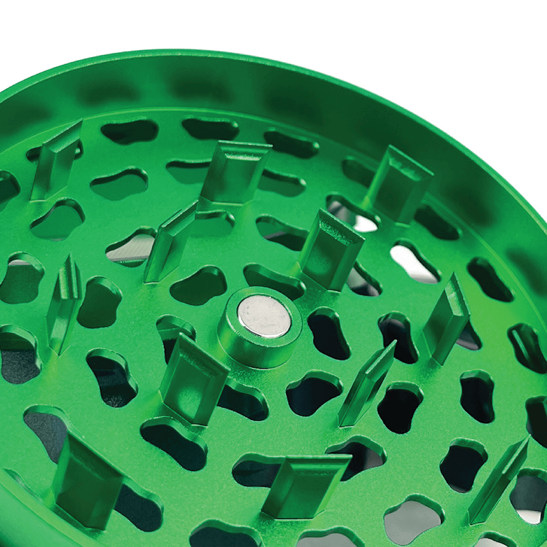 Close-up of the Phoenician 4 Piece Large weed grinder with sharp metal teeth for efficient herb grinding.
