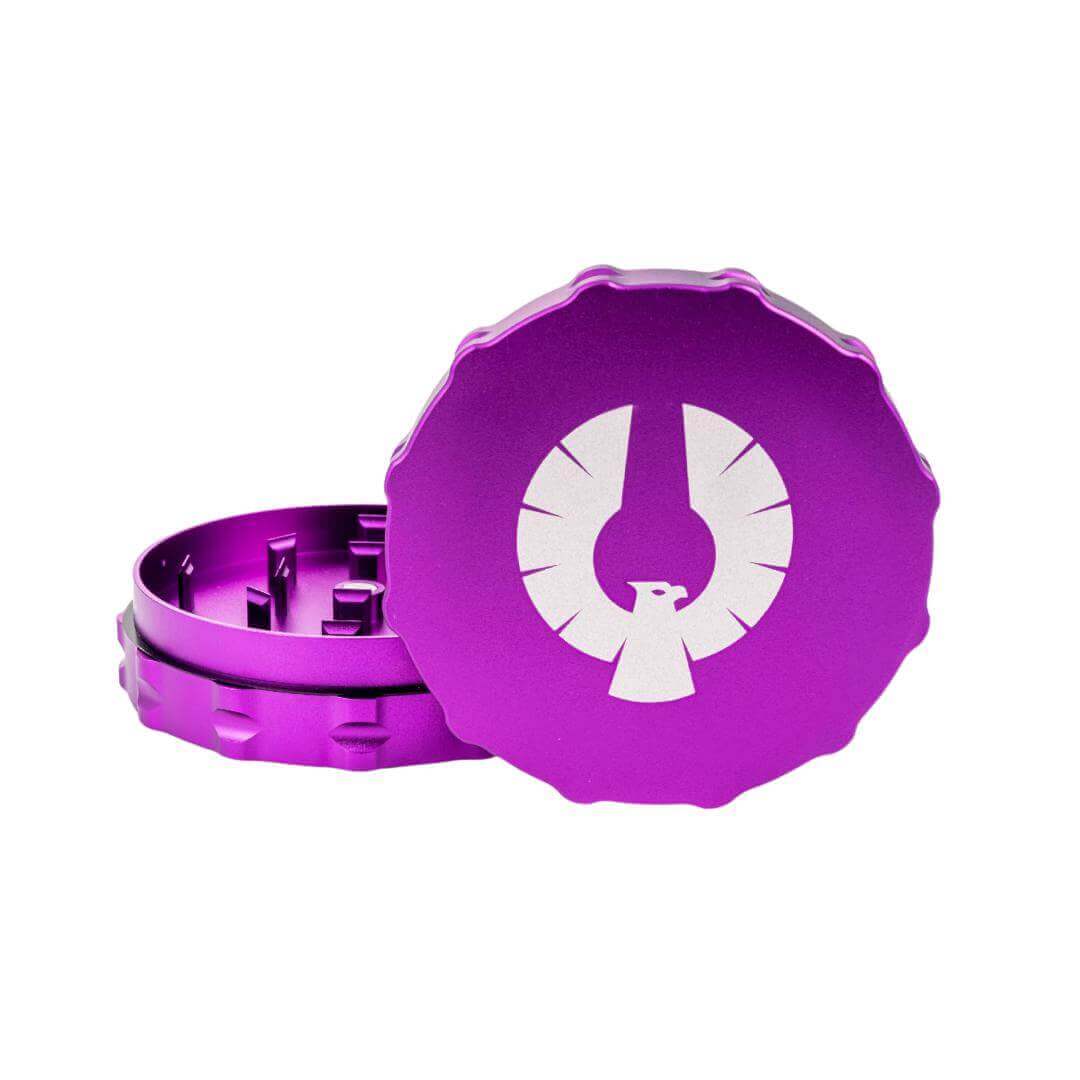 Phoenician 2-piece large grinder in sleek purple aluminum with distinct logo design for perfect herb grinding.