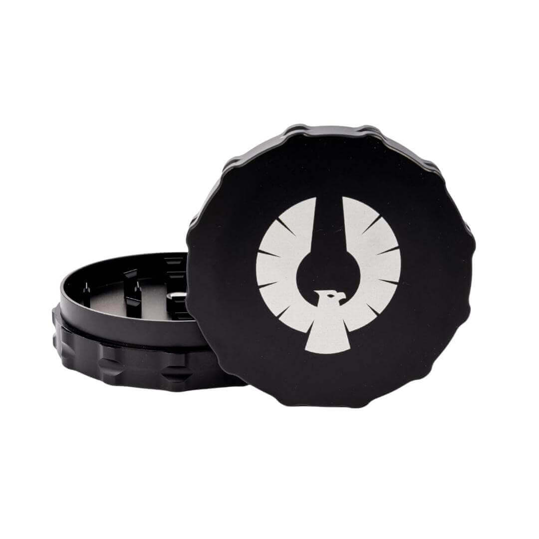 Black Phoenician two-piece grinder with logo, designed for precise herb grinding and durability. Best 2 piece grinder.