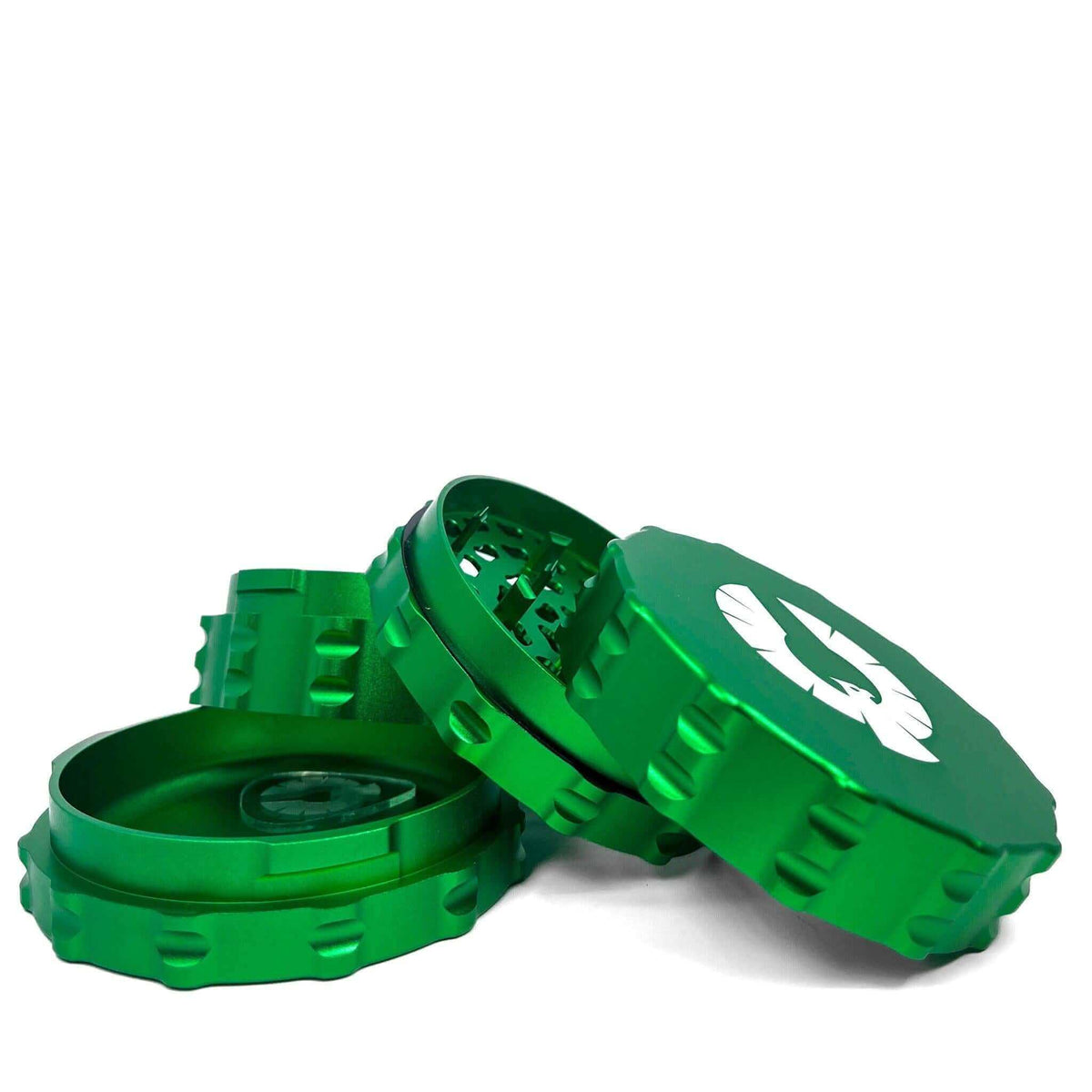Green aluminum large flat top herb grinder with intricate design and multiple compartments.