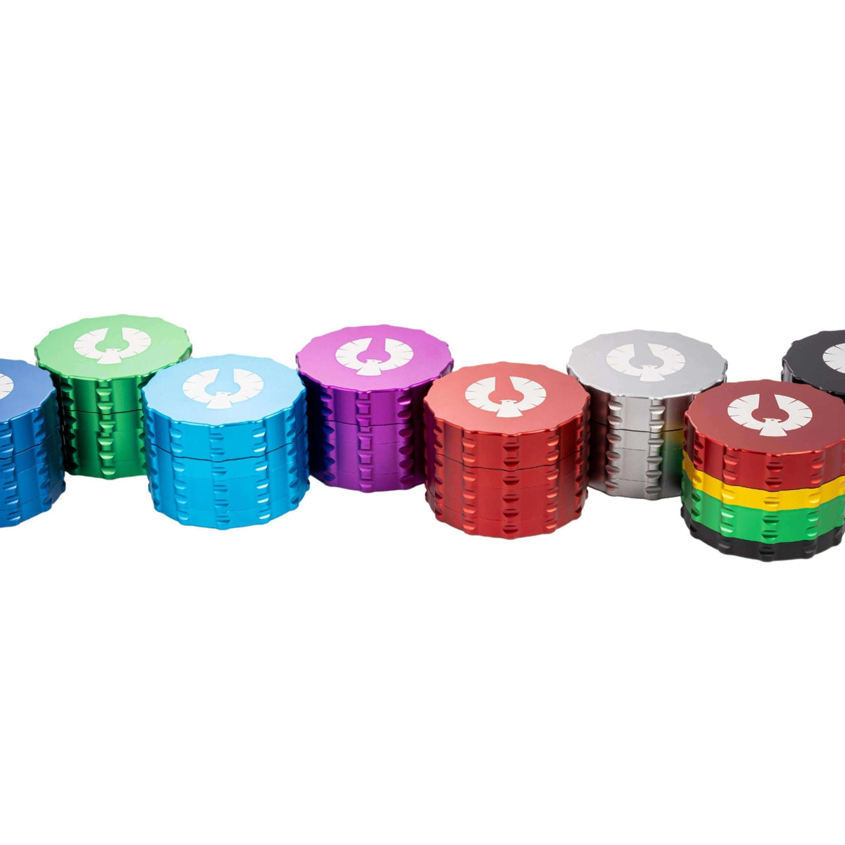 Colorful assortment of large herb grinders made from premium aircraft-grade aluminum.