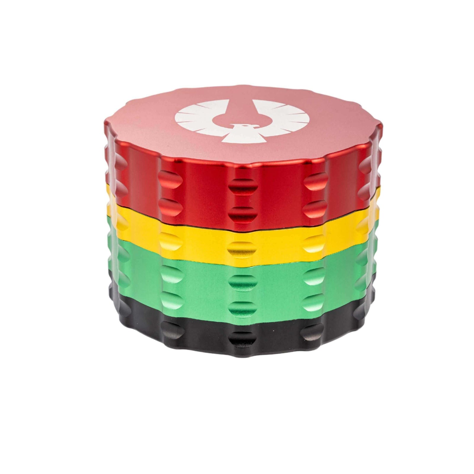 Colorful 4 piece large flat top herb grinder in red, yellow, green, and black, perfect for cannabis enthusiasts.
