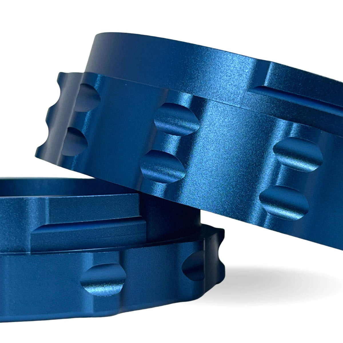 close-up of blue metal weed grinder showcasing precision-engineered design and texture for optimal grinding performance
