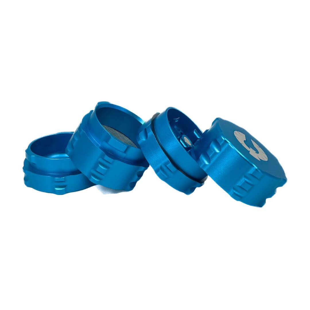 Blue 4 piece herb grinder showcasing sleek design and innovative features ideal for cannabis enthusiasts.