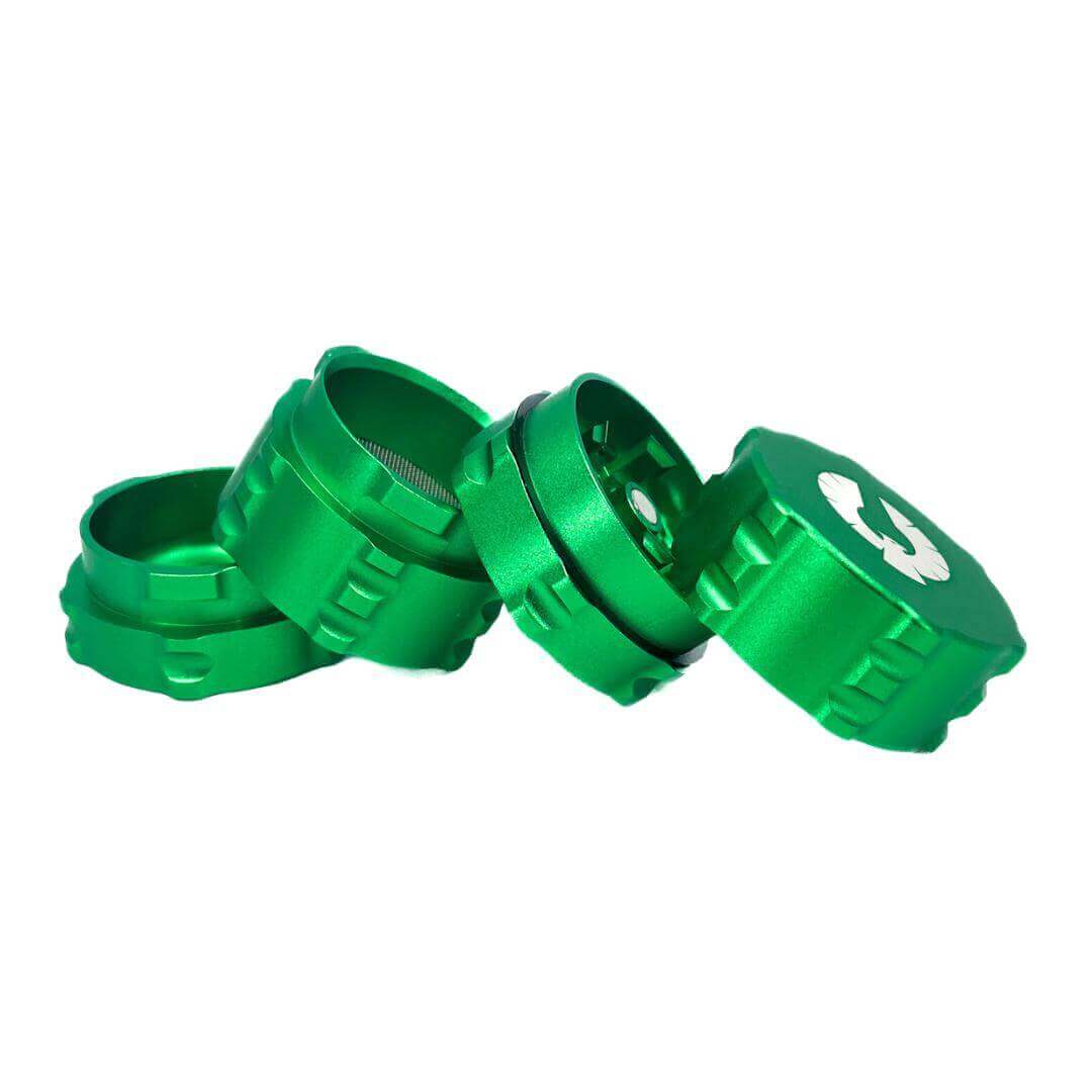 Small 4 piece green herb grinder showcasing innovative design for cannabis enthusiasts.