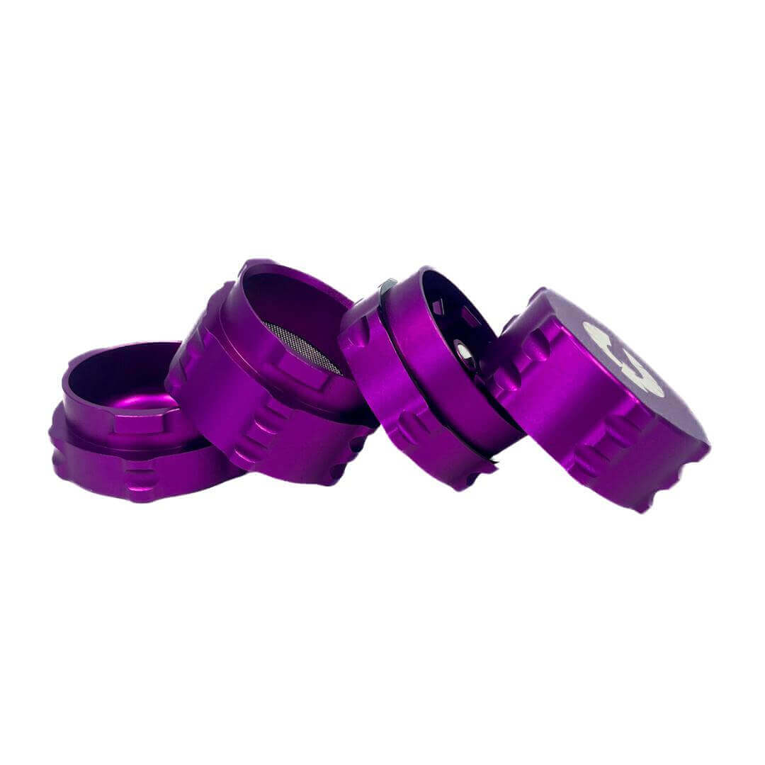Purple 4 piece herb grinder, showcasing sleek design and innovative features for cannabis enthusiasts.