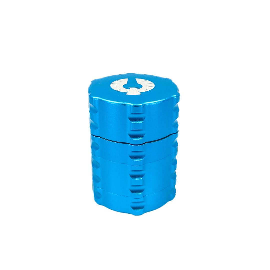 Small 4 piece herb grinder in vibrant blue color by Phoenician, perfect for cannabis enthusiasts.