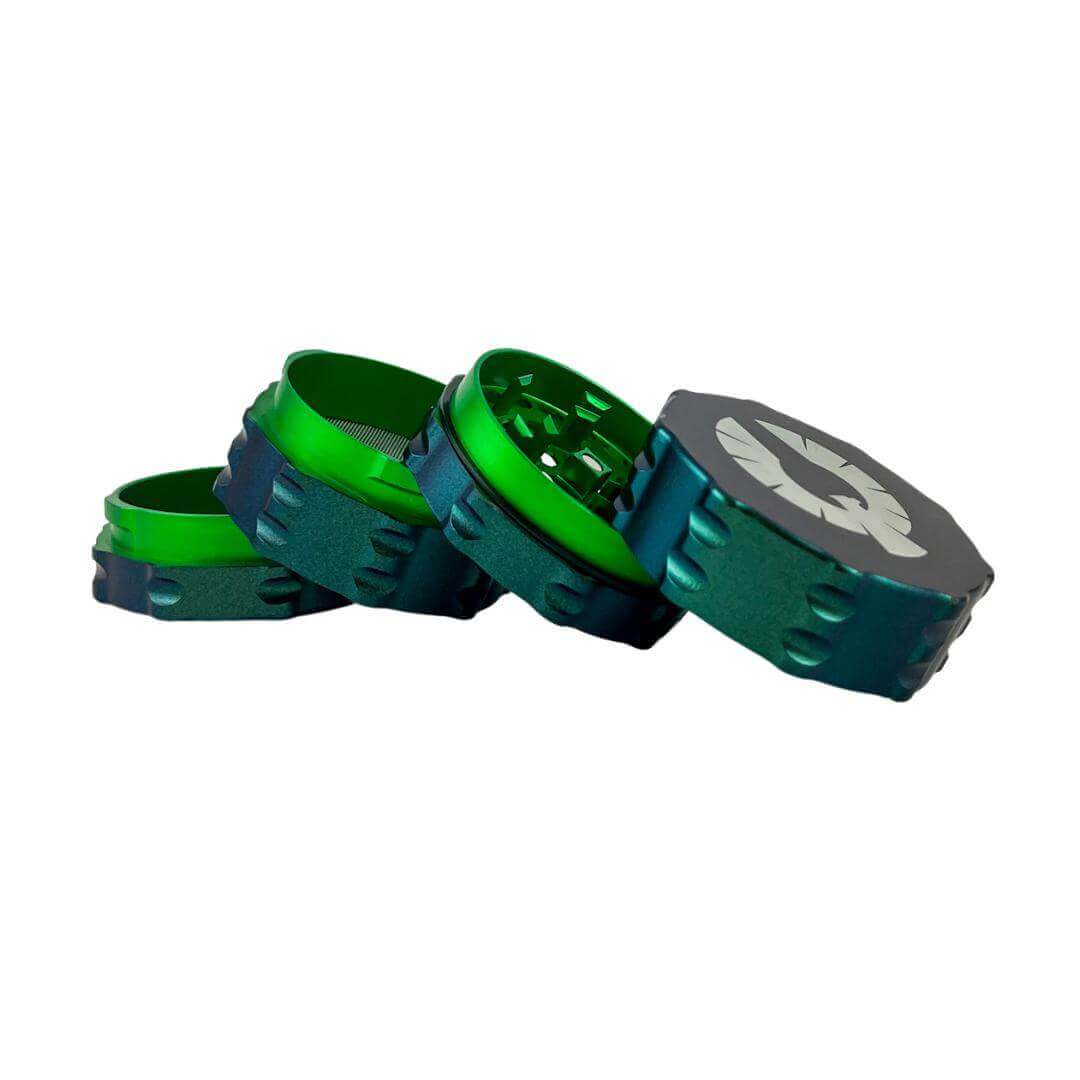 Limited Edition Atlantis Grinder in blue/green color with green interior, showcasing a unique design for smoking accessories.