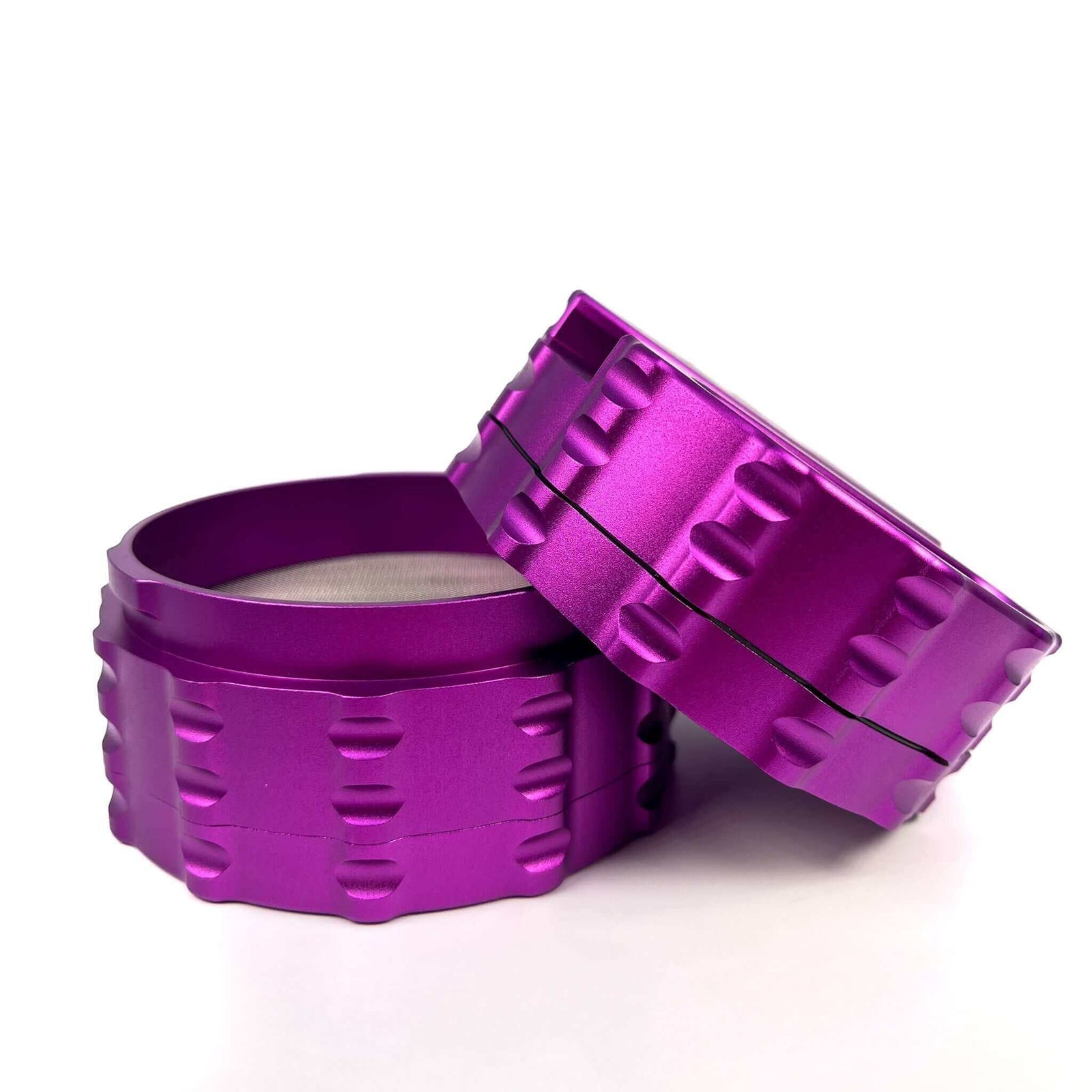 Custom 4 Piece Large Flat Top herb grinder in vibrant purple, showcasing its durable, high-quality design for cannabis enthusiasts.