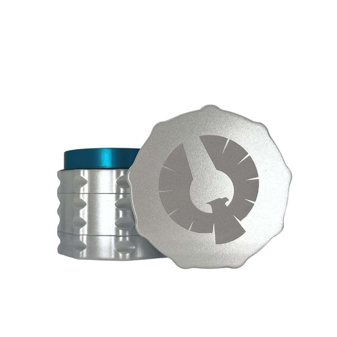 Limited Edition Stardust Grinder with pearl white exterior and teal interior, perfect custom weed grinder for dispensary.