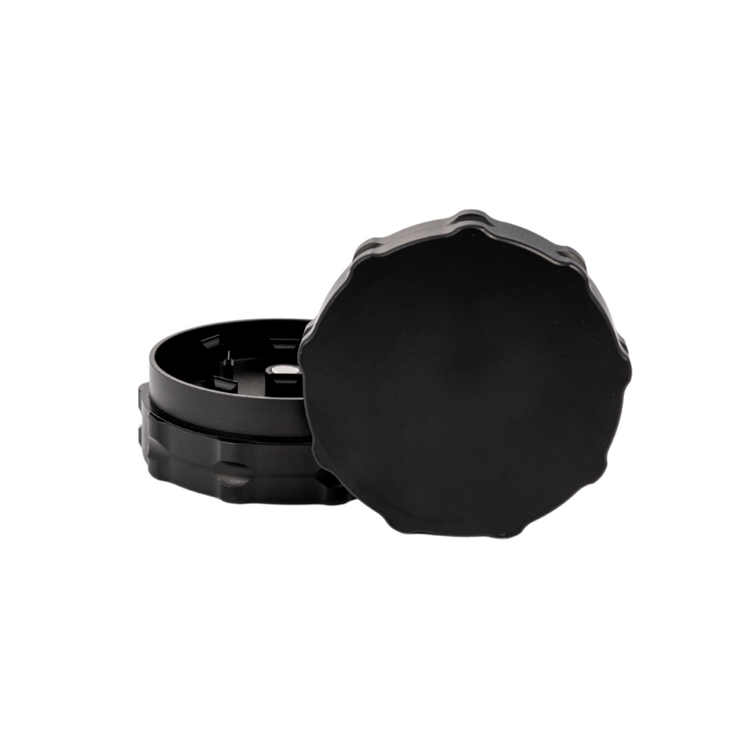 Custom two-piece black weed grinder designed for dispensary use, showcasing precision-engineered craftsmanship.