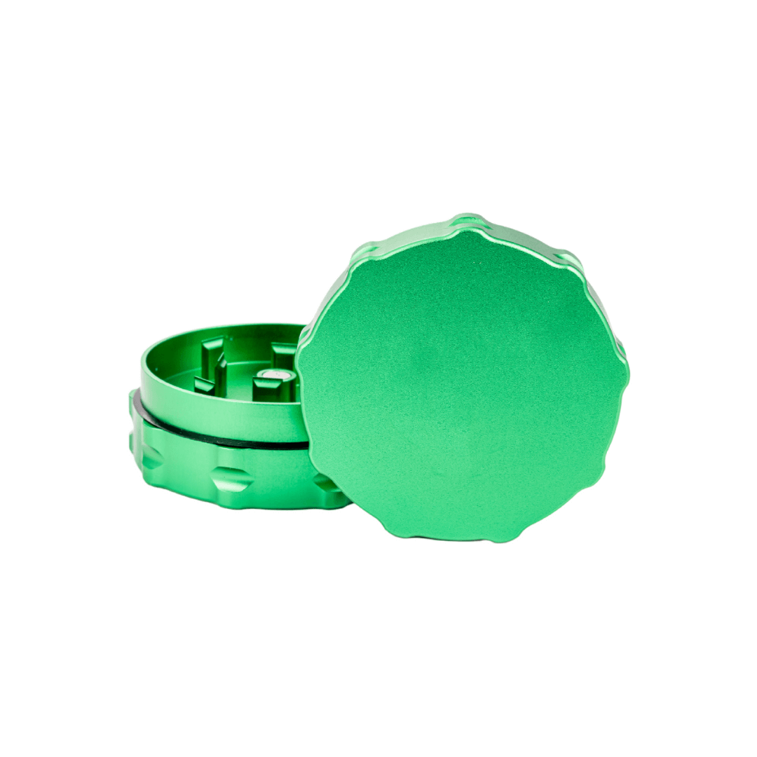 Custom green weed grinder featuring precision engineering and durable aerospace-grade aluminum for dispensary use.