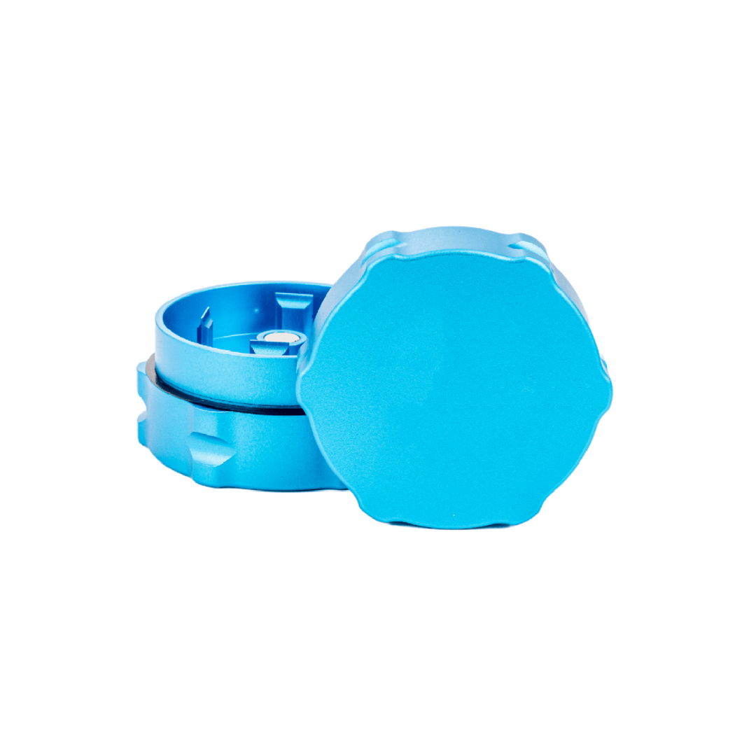 Custom blue two-piece weed grinder, featuring notched grooves and sharp teeth for dispensary use.