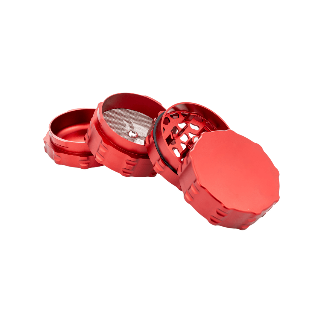Custom 4 piece grinder in black, green, yellow, and red, showcasing sleek design and precision craftsmanship.